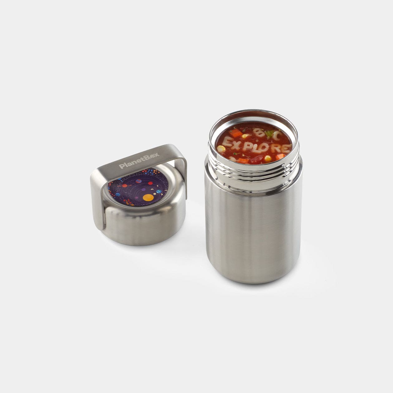 Open view of mercury insulated container. Alphabet soup within spells "Explore". Lid is off to side with Space themed magnet attached to lid.