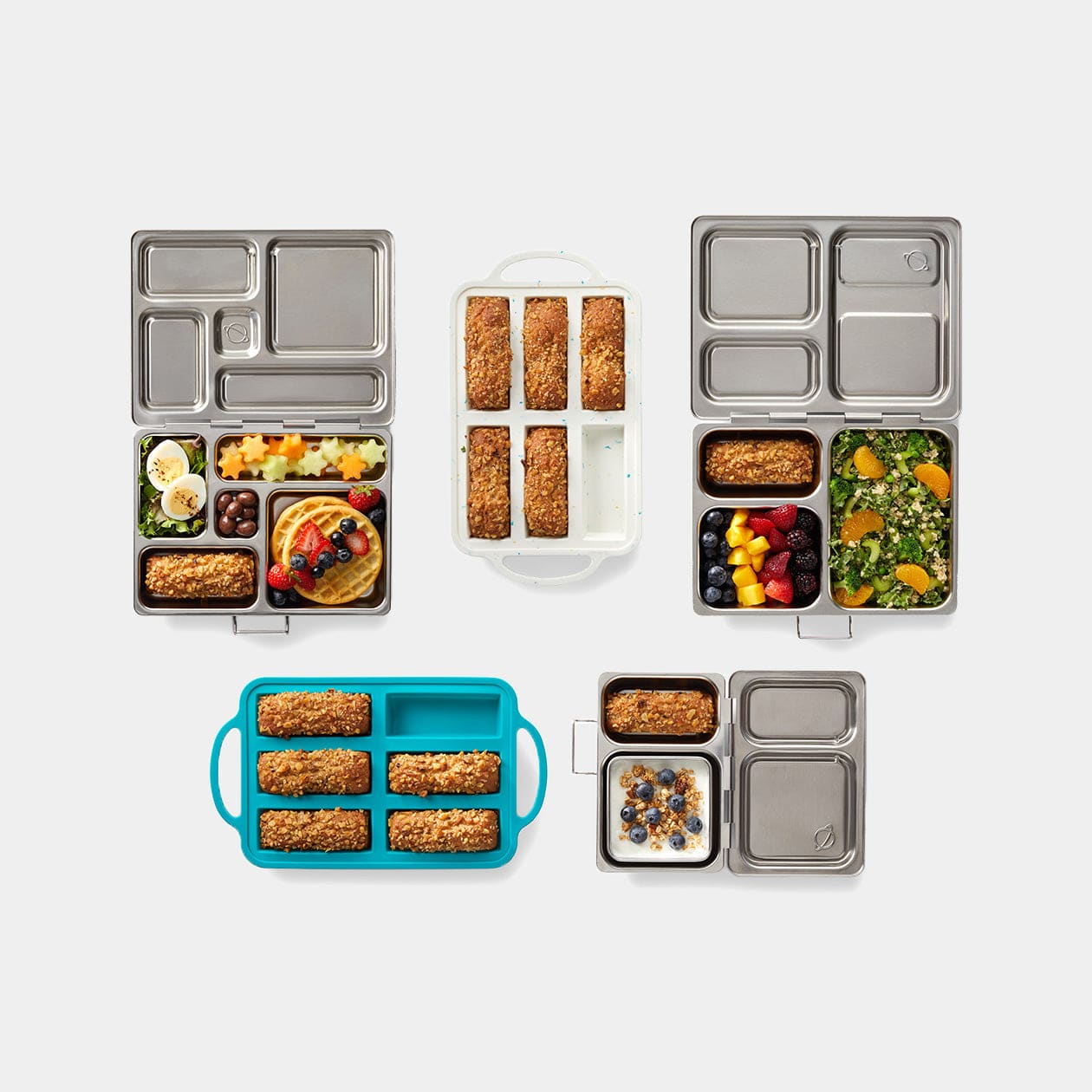 Top-down view of baking trays alongside Rover, Shuttle and Launch lunchboxes to show case the perfect fit baking well size.