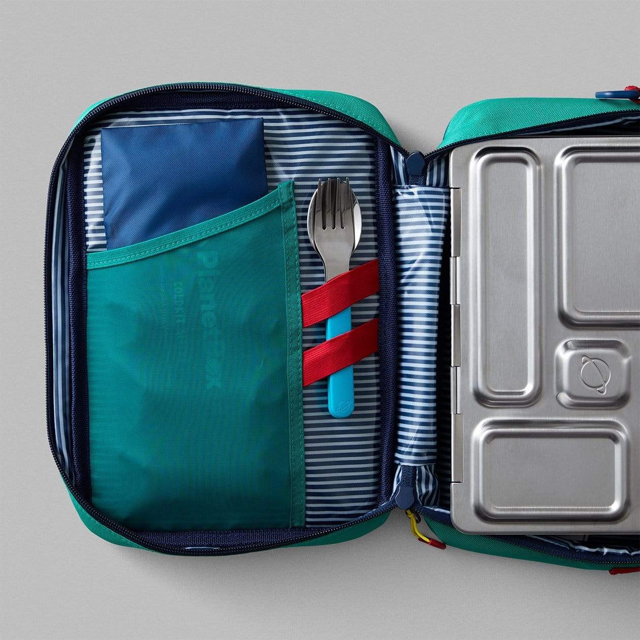 Scuba Blue magnetic utensil set fastened inside lunchbox with included elastics.