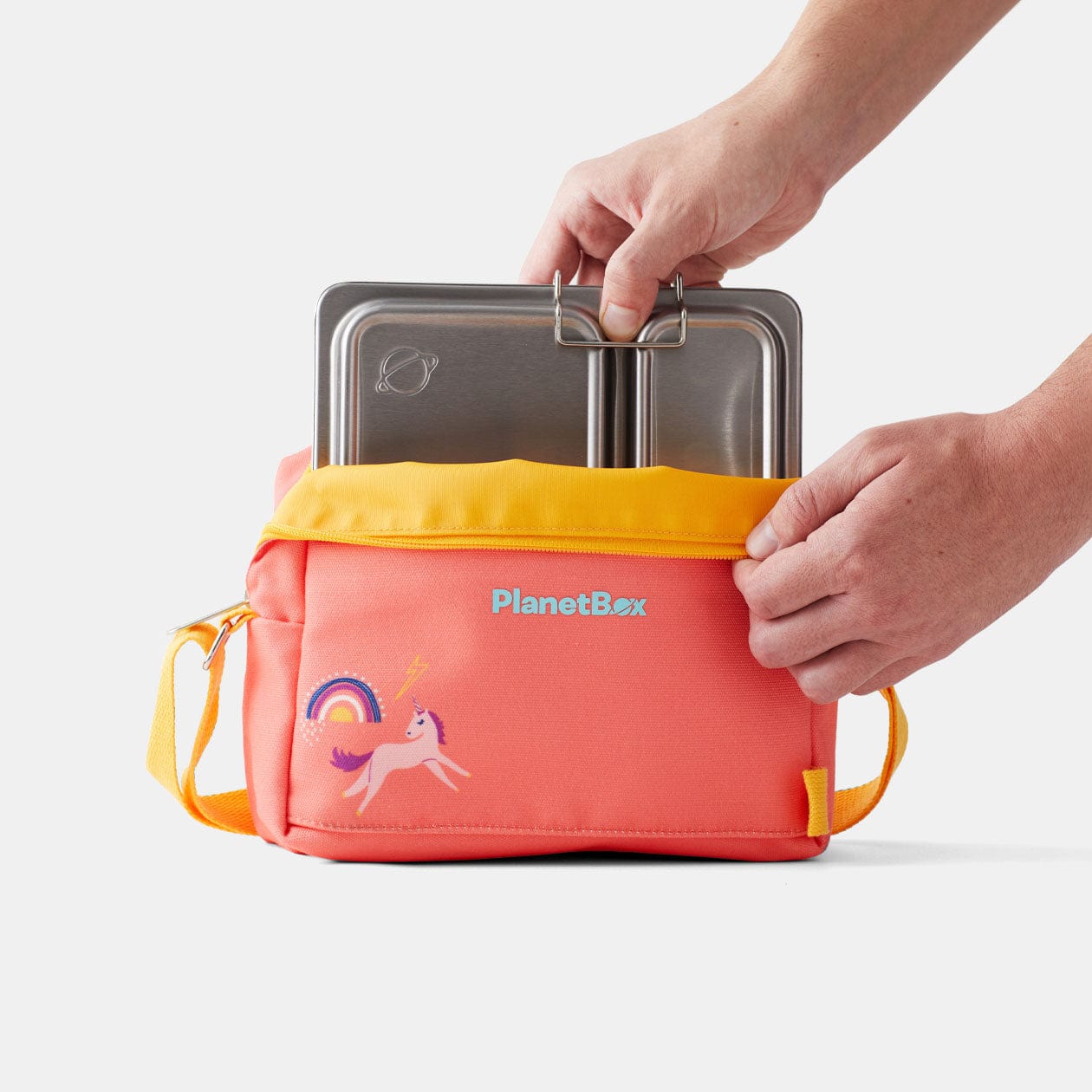 Shuttle lunchbox being placed into Small Carry Bag