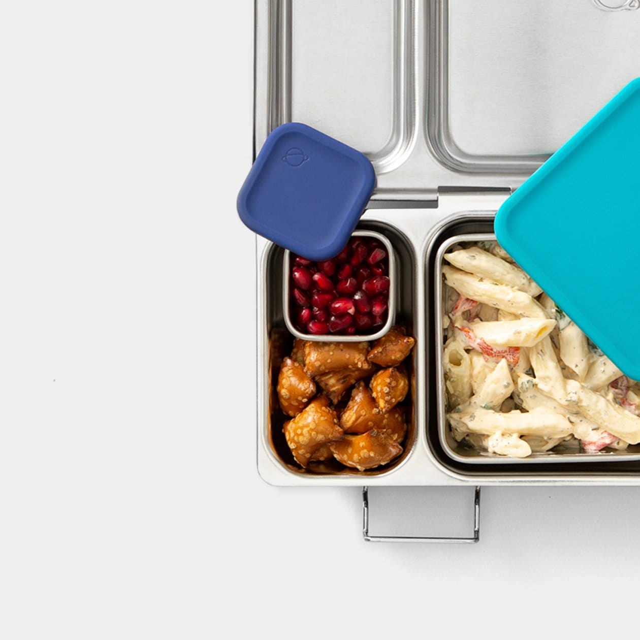 Top down view of Shuttle with food inside and Little Square Dipper with Pomegranate inside.